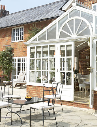 Exterior Of House With Conservatory And Patio