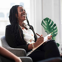 african American mental health therapist laughing