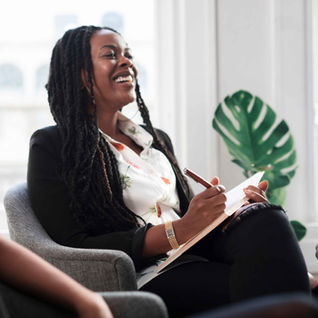 Youth justice worker smiling in a meeting