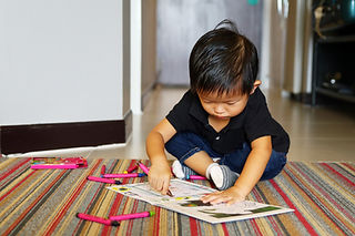 Little Boy with Crayons