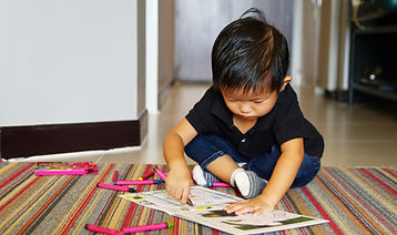 Little Boy with Crayons