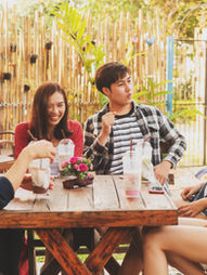 young people enjoy themselves in a cafe'