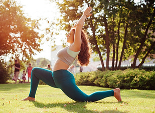 Woman Practicing Yoga Outdoors