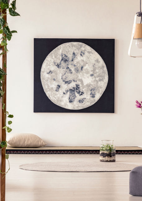 A Moon Image hangs on a wall