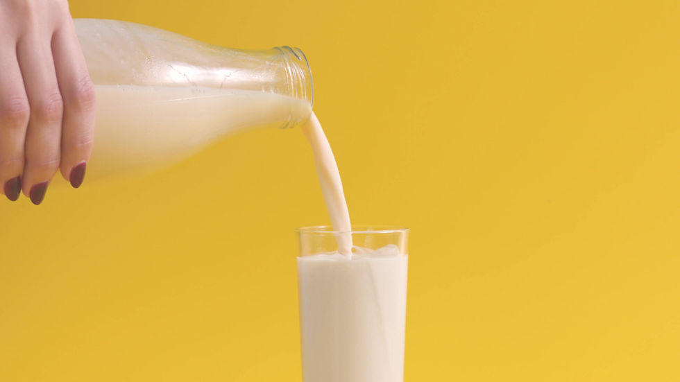 Pouring Milk in Glass