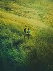 Couple Walking Field