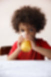 Small boy Drinking Orange Juice