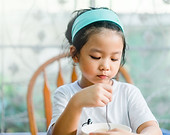 Girl Eating a Meal