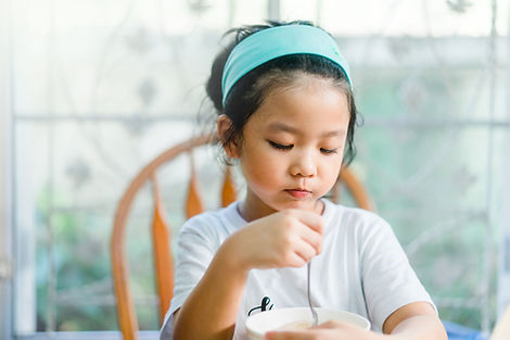 Girl Eating a Meal