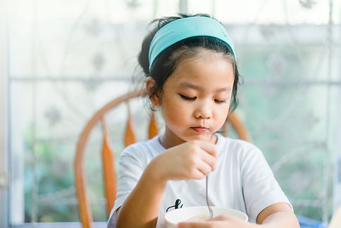 Girl Eating a Meal