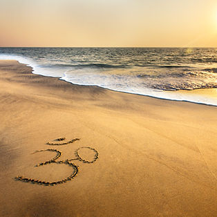 Om Symbol on the Beach