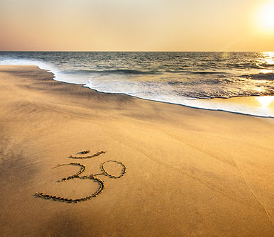 Om Symbol on the Beach