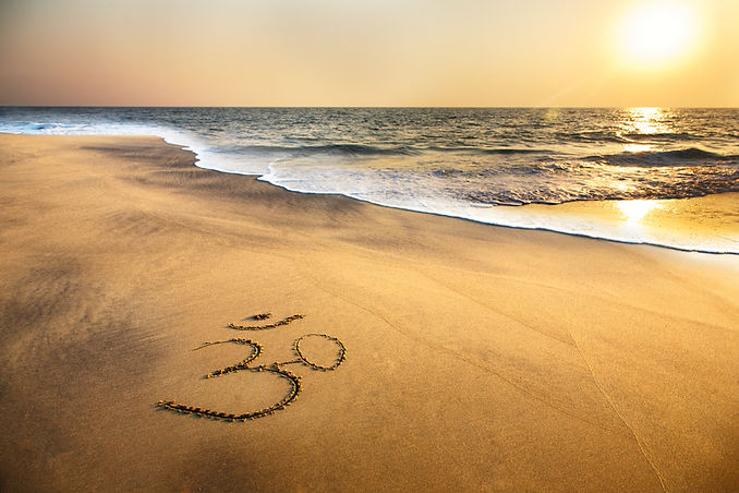 Om Symbol on the Beach