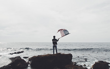 Man Waving American Flag