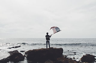Man Waving American Flag