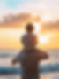 Child on Shoulders at Sunset