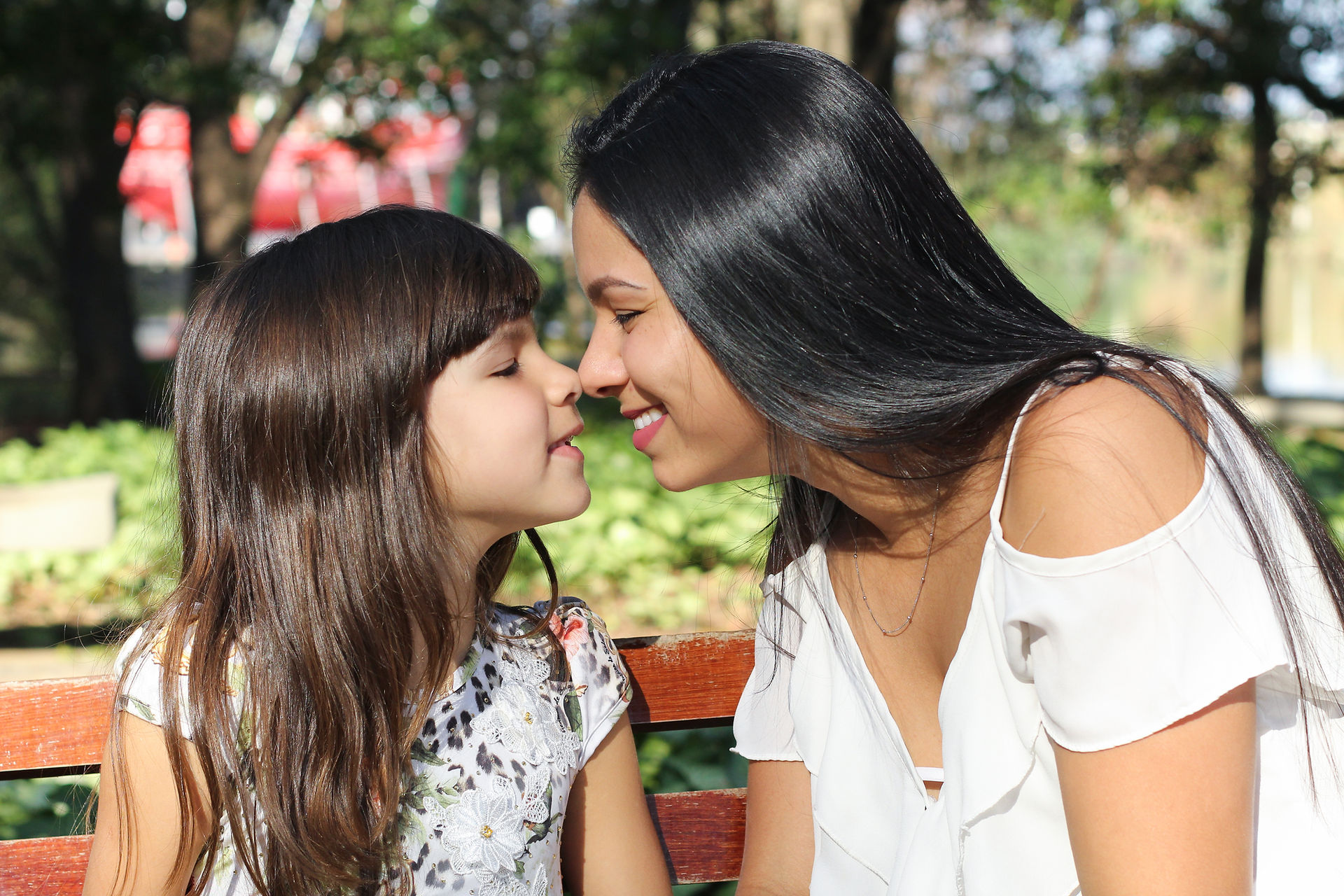 Image of a mother and daughter putting their noses together. If your child or teen struggles with anxiety from school, relationships, and more learn how therapy for teens in New York, NY can help.