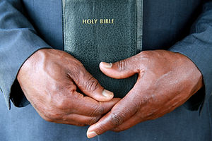 Hands Holding Bible