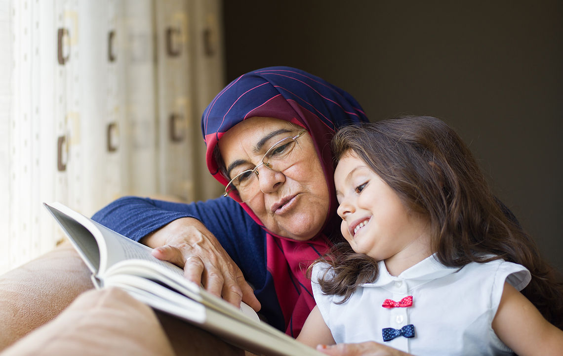 Reading to Little Girl