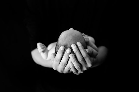 Newborn in Hands