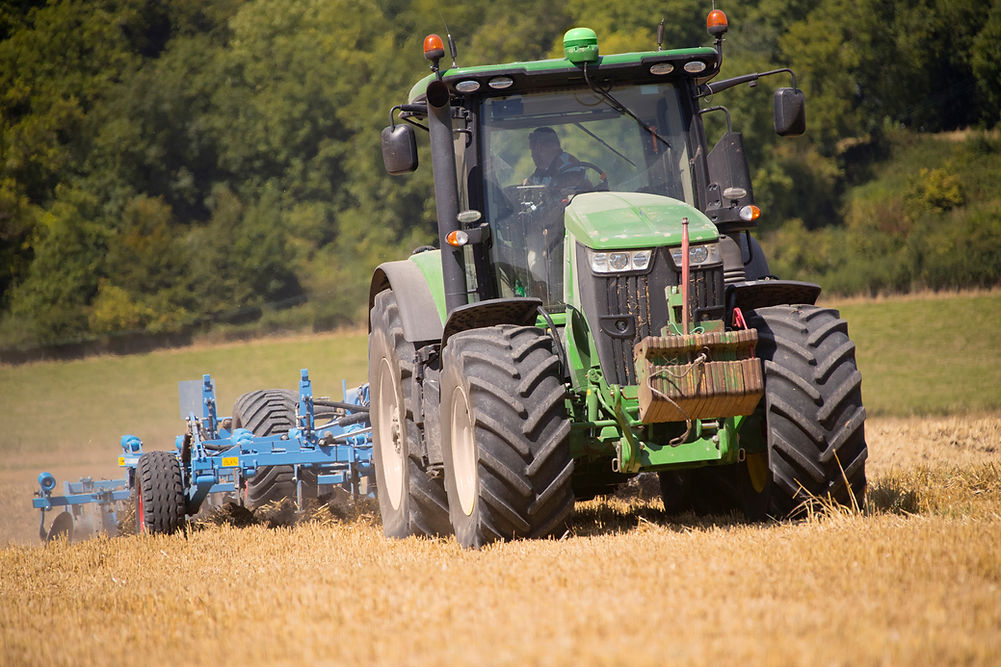 Tractor Ploughing Field Using Disc Plough