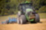 Tractor Ploughing Field Using Disc Plough