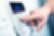 Close-up of a hand pressing a button on a security keypad