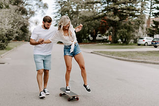 Couple Skateboarding Together