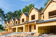 Framed multi-unit housing under construction.