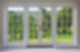 A set of finely crafted wooden georgian style windows with doors set in a white frame