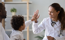 Doctor high-fiving child