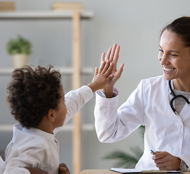 Doctor high-fiving child