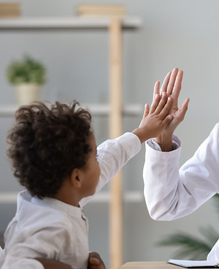 Doctor high-fiving child
