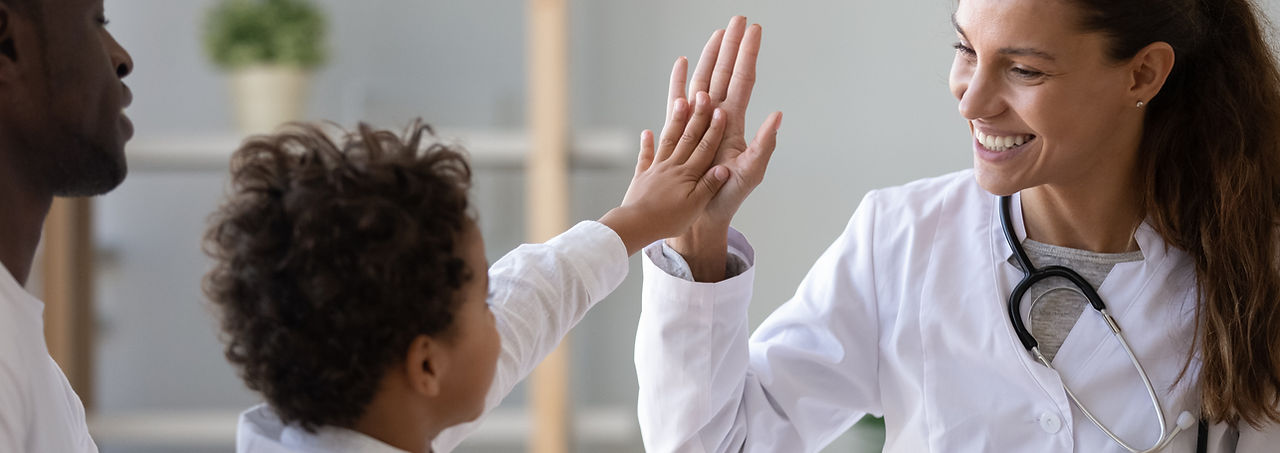 Doctor high-fiving child