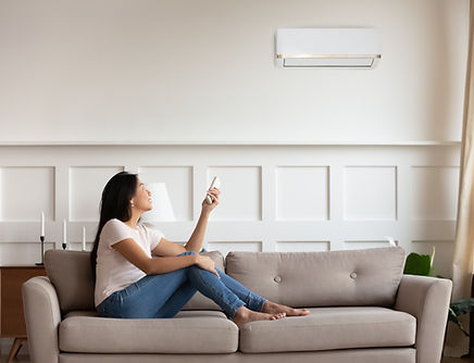 Person Using AC Remote Control