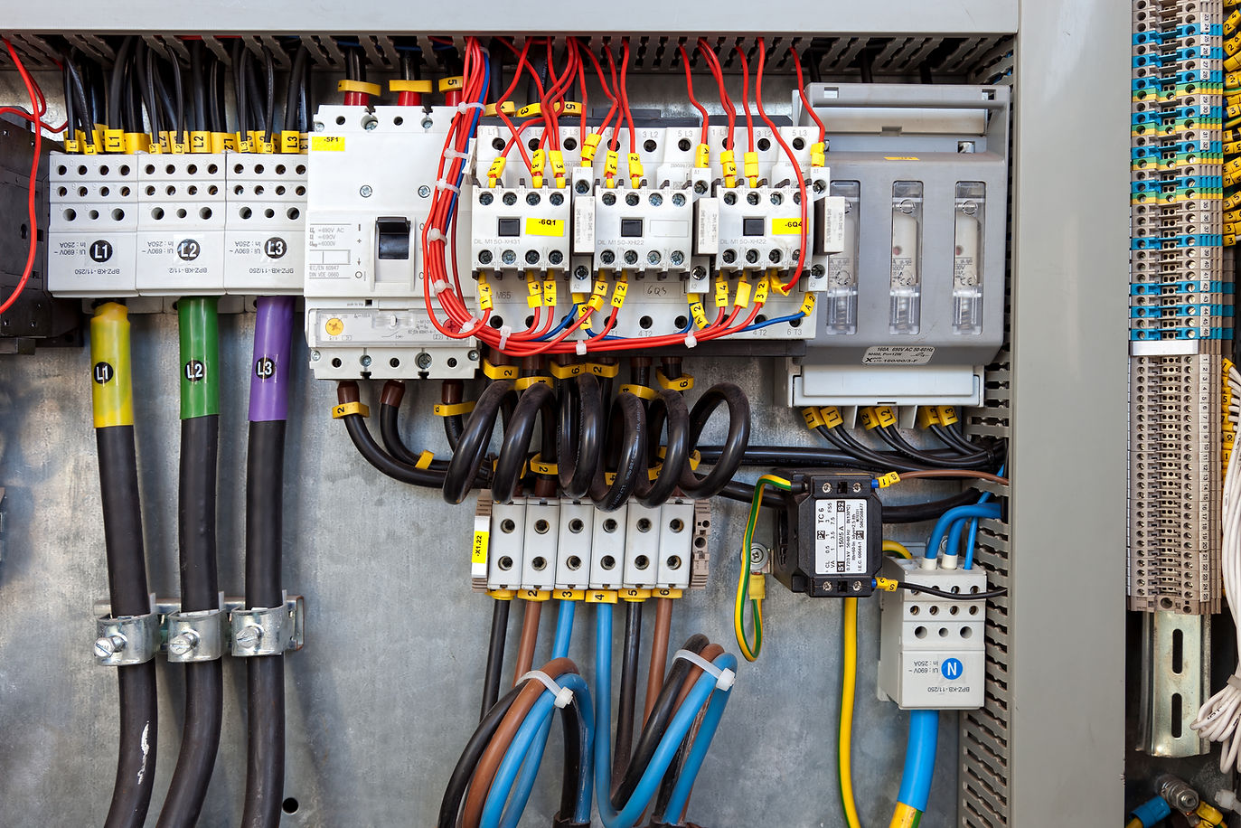 An electrical panel with many controls and switches