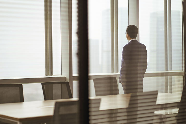 Business Person Looking Out Window