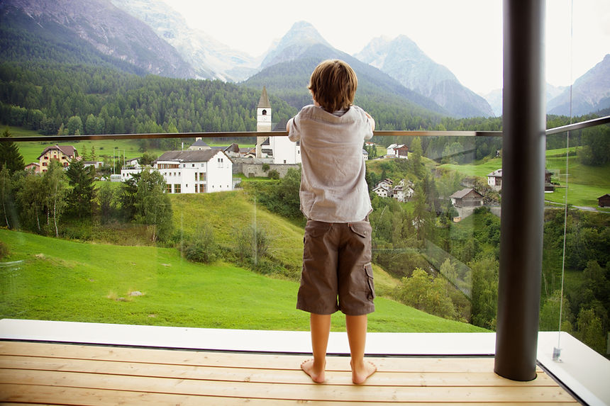 Child on glass balcony