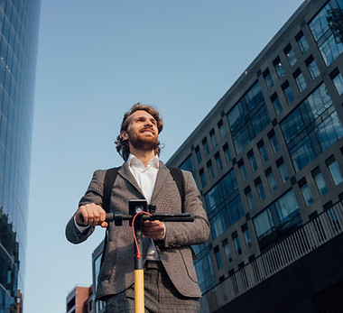 Office worker riding a scooter