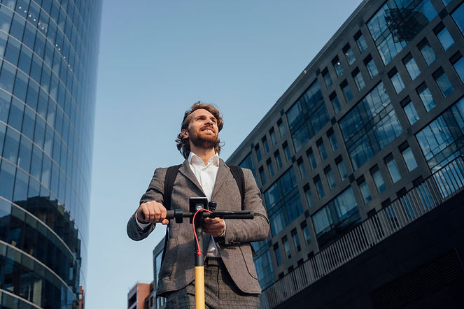 Office worker riding a scooter