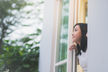Women peering out the window