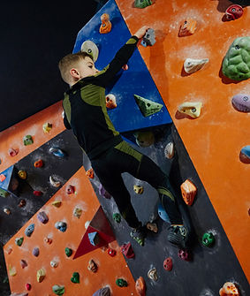 Boy Climbing a Wall