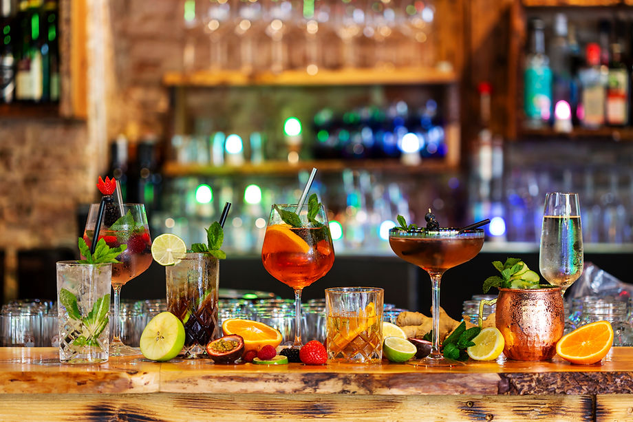 Assortment of alcoholic cocktails on a bar counter