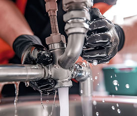 Plumber Fixing Sink
