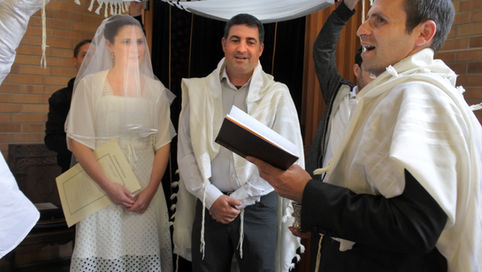 אמירת הפסוקים בשעת כריכת התפילין