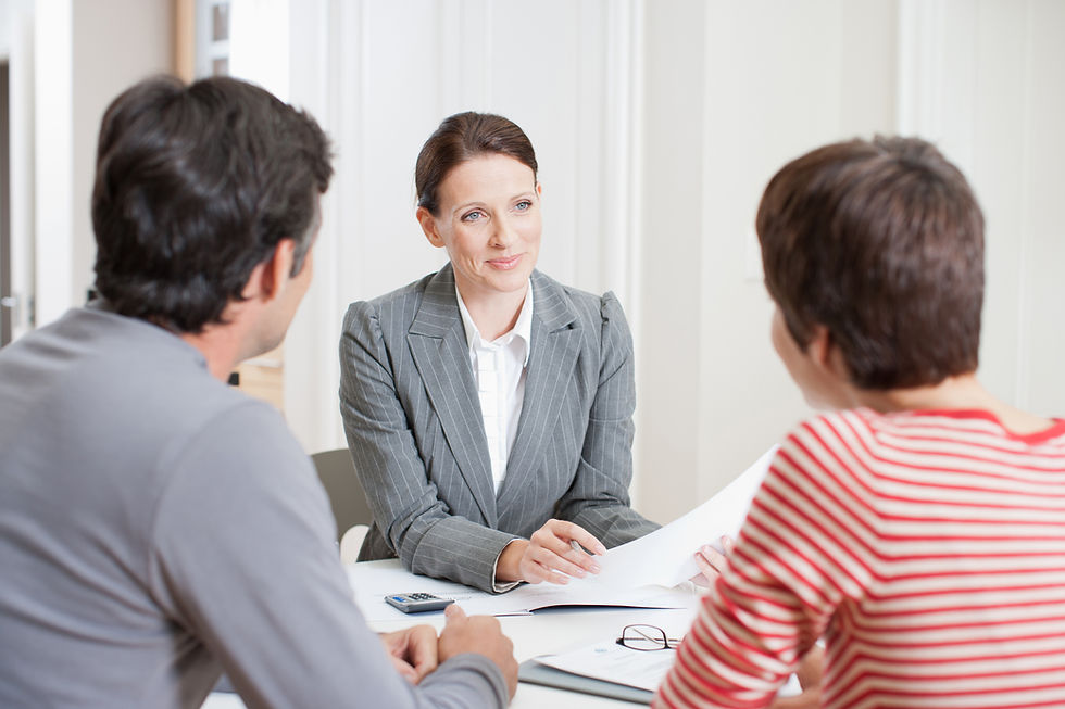 Couple meeting with real estate agent
