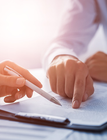 Business people negotiating a contract.