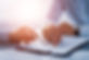 Close-up of two hands reviewing a document