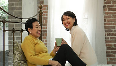 Mom and Daughter Smiling Together