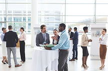 Attendees networking at a conference event.